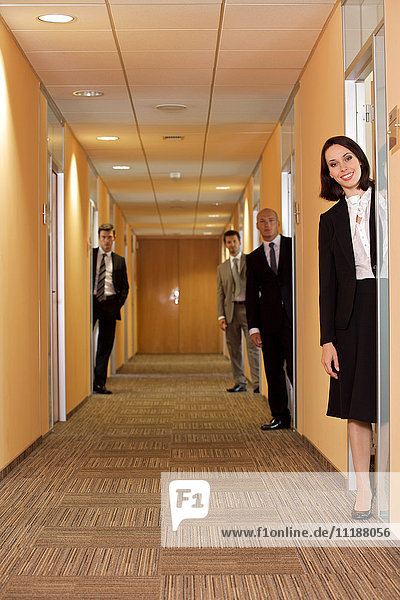 Business people standing in corridor