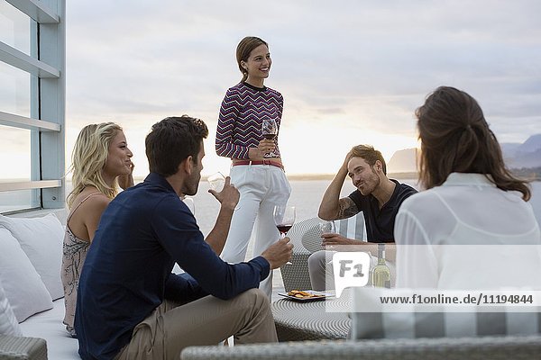 Group of friends enjoying wine at a resort