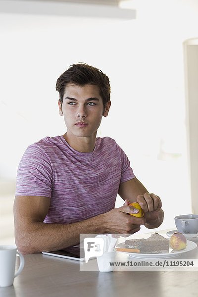 Close-up of a young man having breakfast