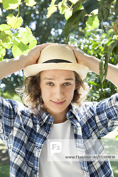 Young man wearing sun hat  portrait
