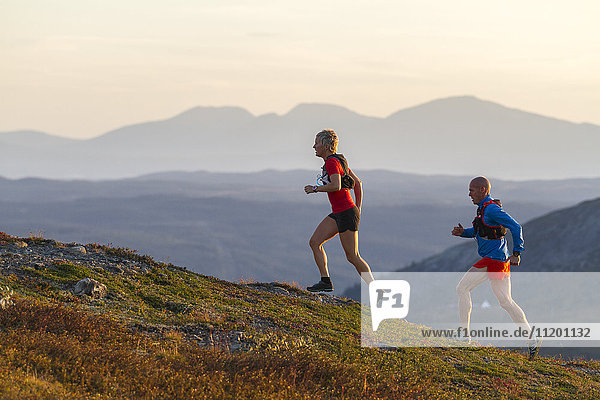 Couple running in mountains