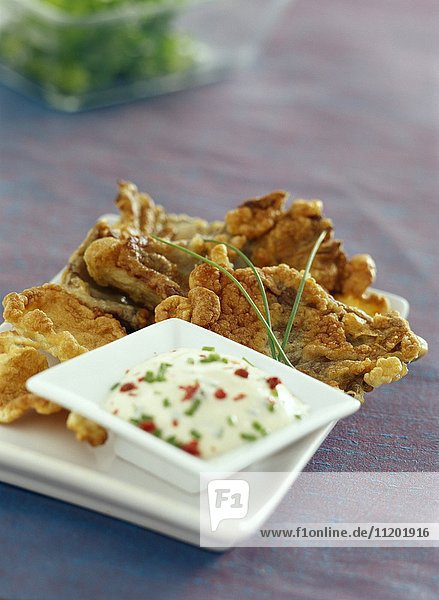 Parasol mushroom fritters with a dip