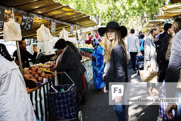 Young woman on busy market