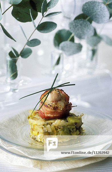 Scallops and foie gras on a bed of stewed leeks