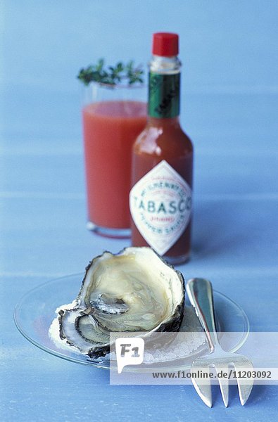 Fresh oysters and tomato gazpacho with tabasco