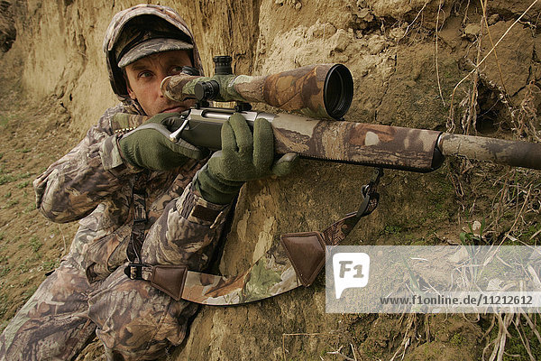 Varmint Hunter With Rifle