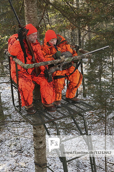 Father And Son In Tree Stand