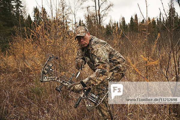 Bowhunter Ground Stalking Turkey while hunting