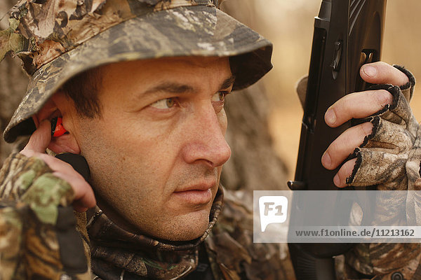 Hearing Protection On Rifle Hunter