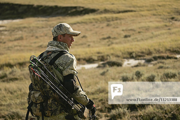Bowhunter Hunting Antelope On Prairie