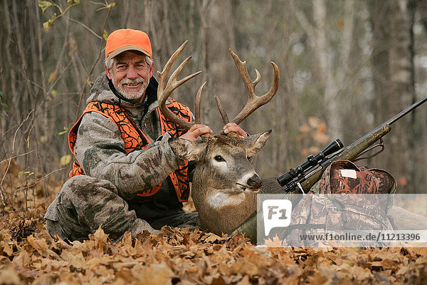 Deer Hunter With Dead Deer