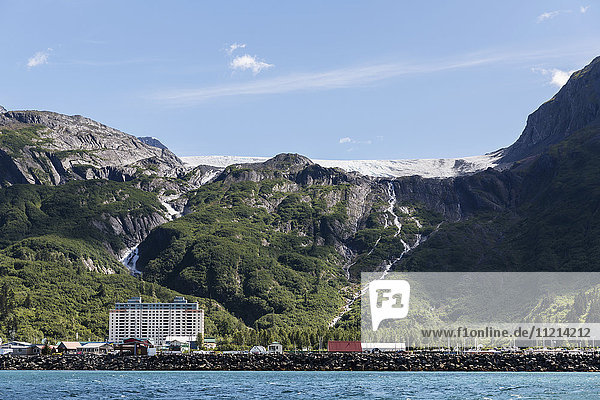 The City of Whittier and the Begich Towers seen from the Ocean on a clear Sunny day  Whittier  South Central Alaska  USA  Summer