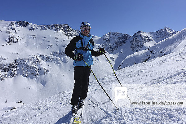 Skier against Blackcomb Gemstone Bowls; Whistler  British Columbia  Canada