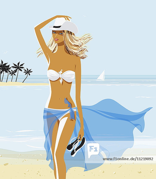 Sexy woman in bikini and cowboy hat on beach
