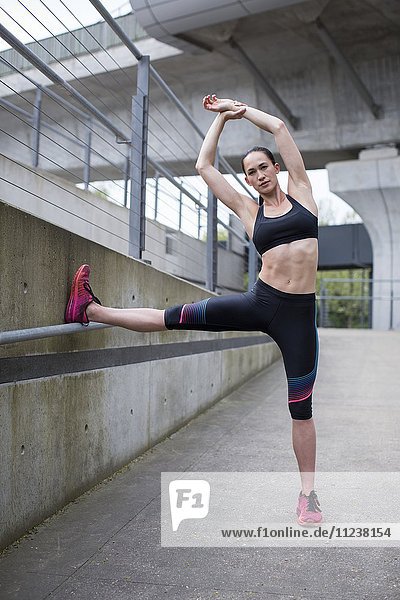 Woman stretching in sports wear