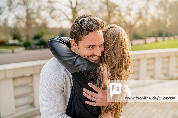 Romantic young couple hugging in Battersea Park  London  UK