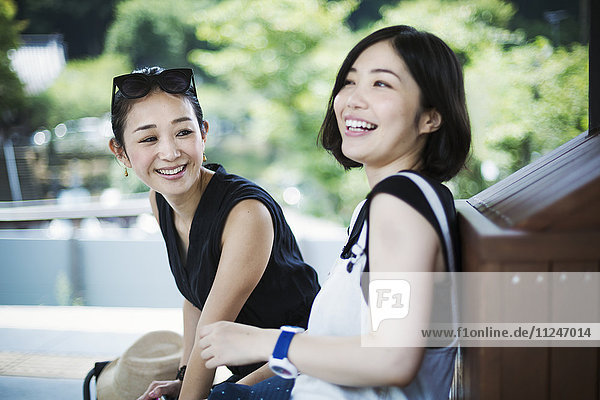 Portrait of two smiling young women.