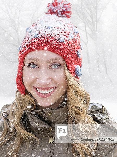 Portrait of woman in red knit hat