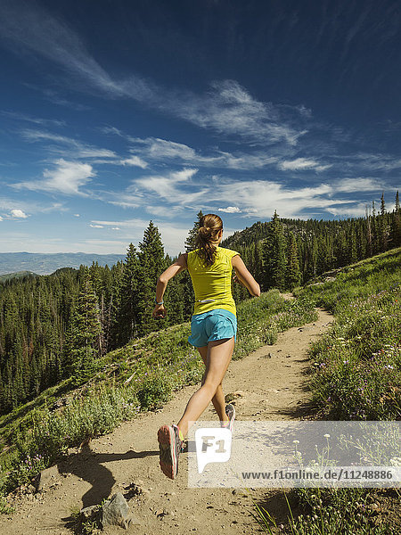 Mature woman running in mountains