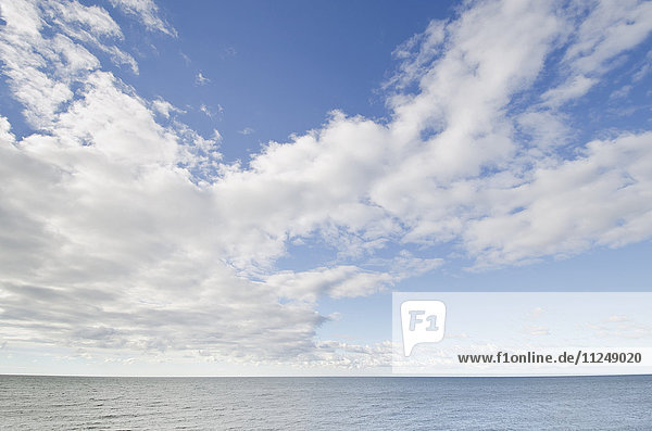 Seascape and cloudy sky