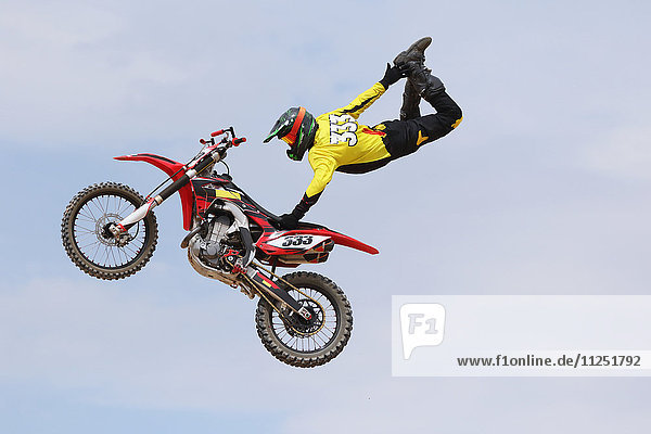 Motocross racer jumping in the air