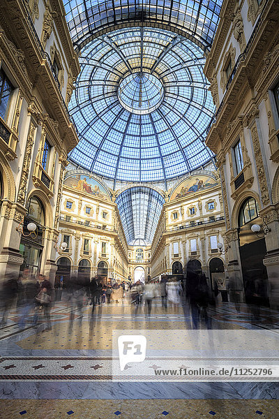 The shopping arcades and the glass dome of the historical Galleria Vittorio Emanuele II  Milan  Lombardy  Italy  Europe