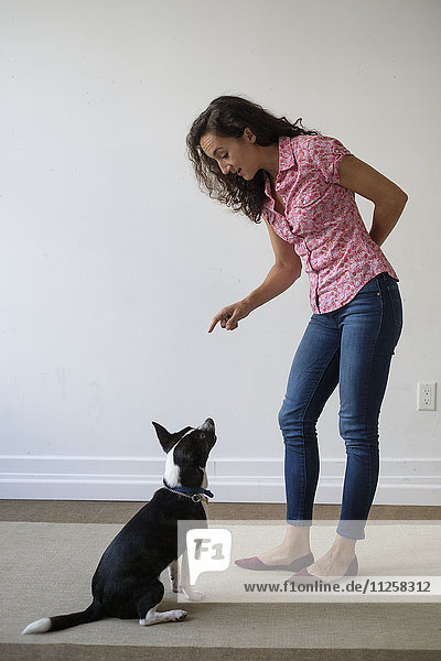Young woman training her dog