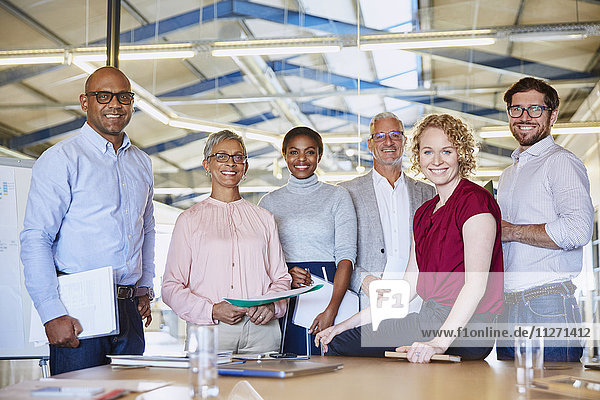 Portrait confident business people in conference room