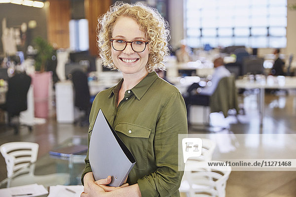 Portrait smiling businesswoman in office