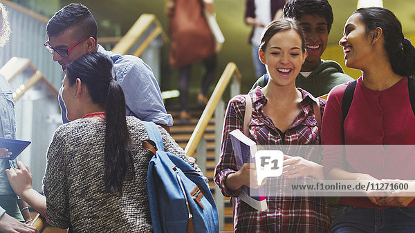 Smiling college students in stairway