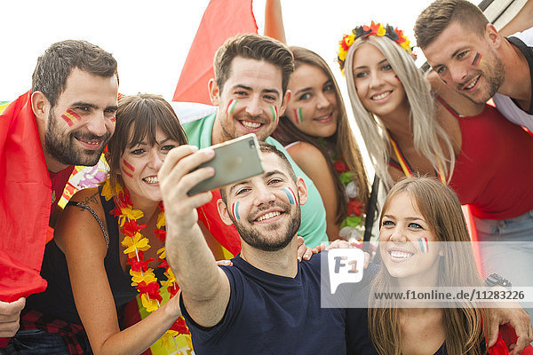Group of soccer fans taking a selfie