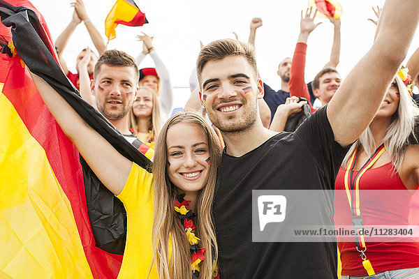 Group of German soccer fans cheering