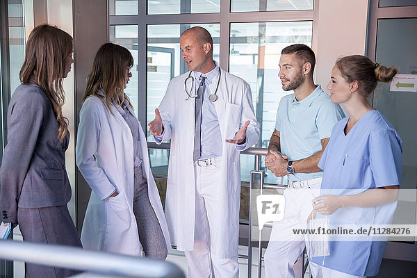 Doctor talking to his team in medical clinic