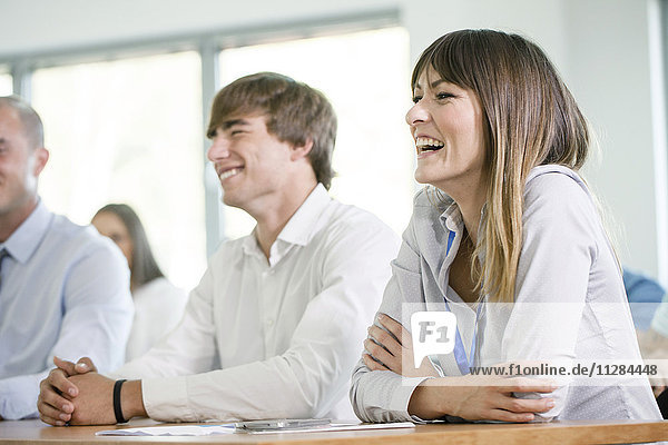Healthcare workers in training class laughing