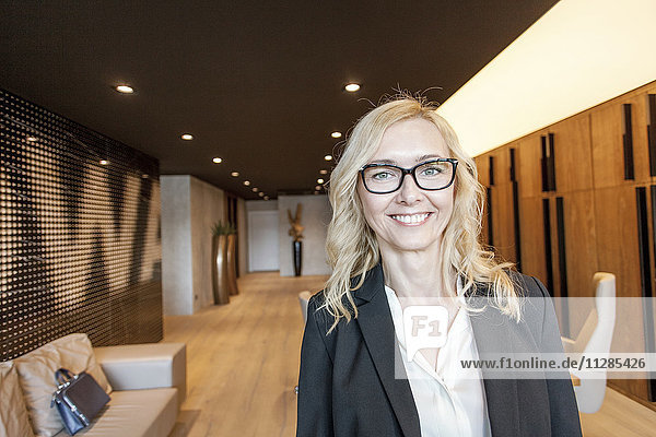 Portrait of businesswoman in lobby