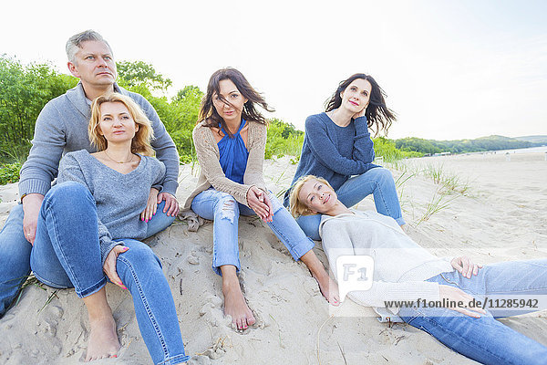 Group of friends on beach relaxing