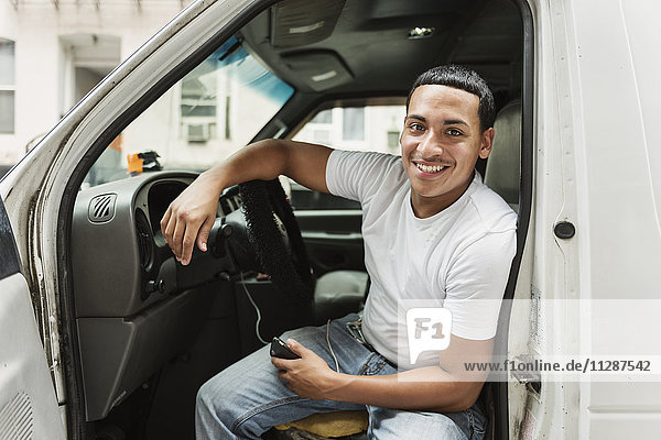 Smiling man in car