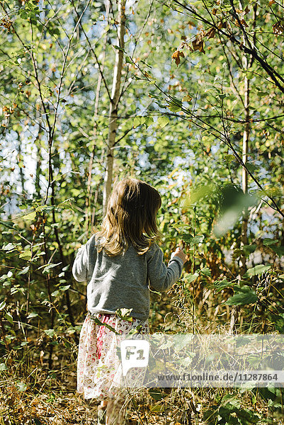 Girl walking in woods