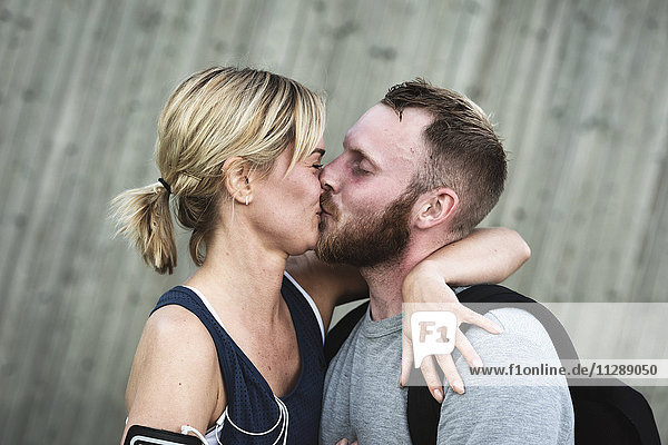 Mid adult couple kissing