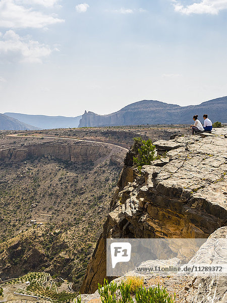 Oman  Jabal Akhdar  Two women looking at mountain view