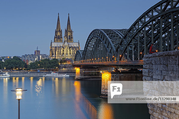 Germany  Cologne  lighted Cologne Cathedral and Hohenzollern Bridge
