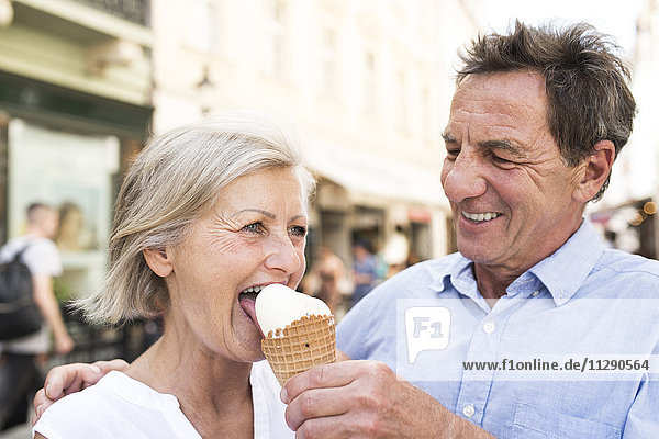 Happy senior couple with ice cream cone