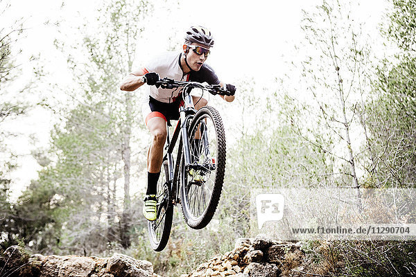 Mountainbiker jumping midair