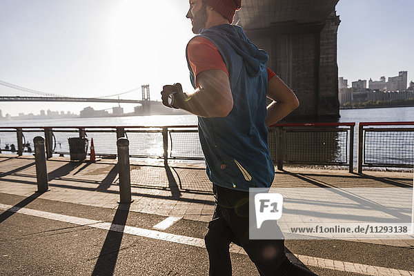 USA  New York City  man running at East River