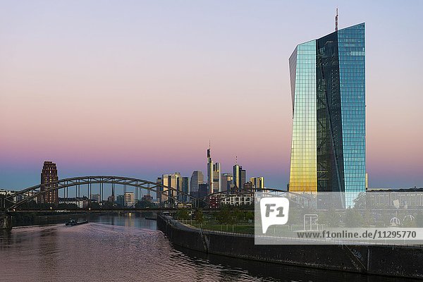European Central Bank at sunrise  in front of Frankfurt skyline  Frankfurt  Hesse  Germany  Europe