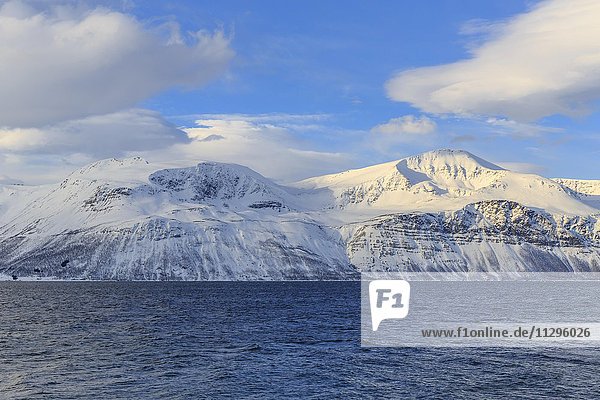 Snowy mountains and Småtuva Stortuva fjord  Ullsfjord  Troms Province  Norway  Europe