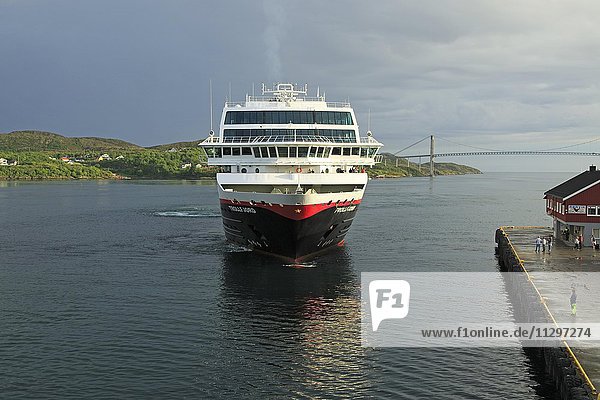 Hurtigruten ship Trollfjord arriving at port of Rorvik  Lofoten  Norway  Europe