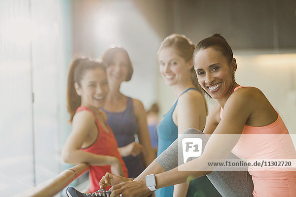 Portrait smiling women in gym studio