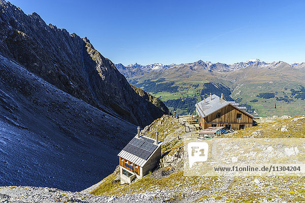 The Lischana hut SAC (Swiss Alpine Club) above Scuol in the Lower Engadine  Switzerland. View to the Silvretta Alps.