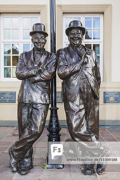 England Cumbria Lake District Ulverston Statue of Laurel and Hardy in front of The Coronation Hall Theatre
